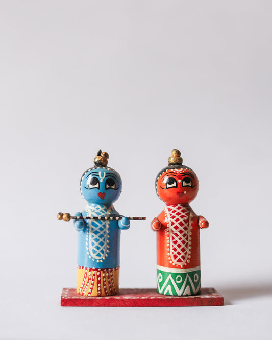 Two colorful figurines on a white background