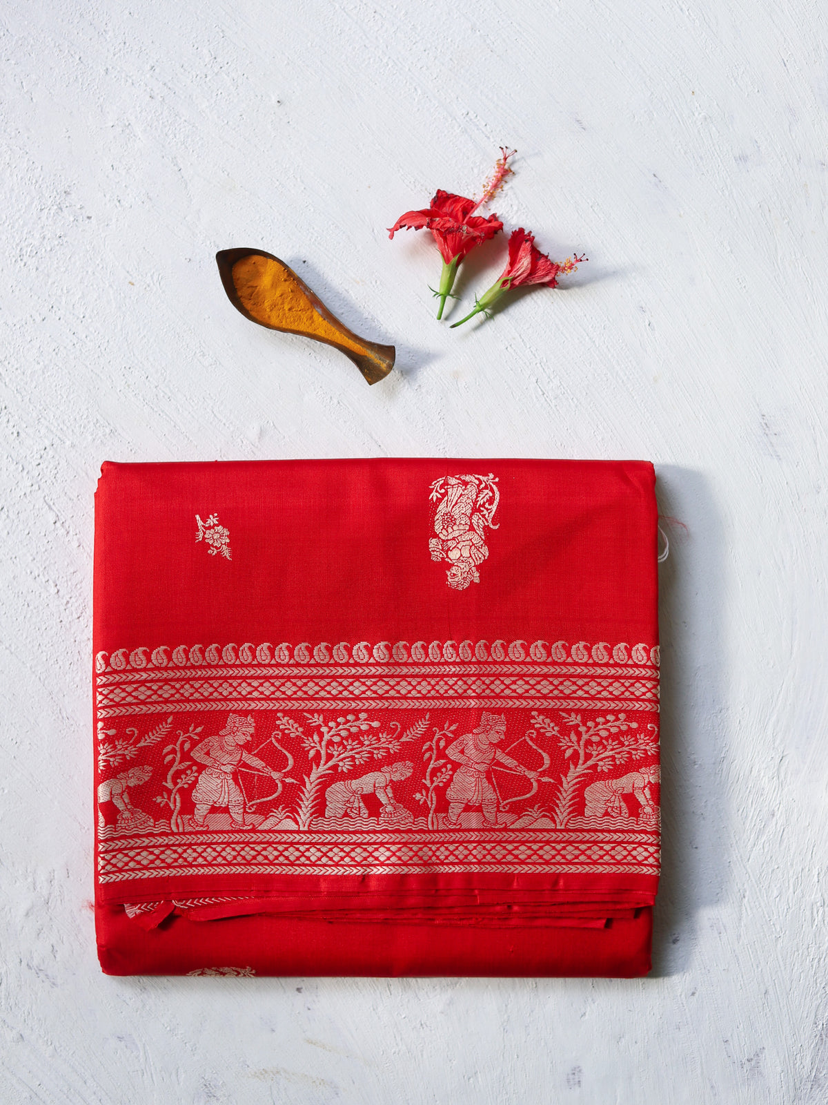 Traditional Handwoven Baluchari Mulberry silk wedding saree in Black with red patterns on a light background for bengali bride