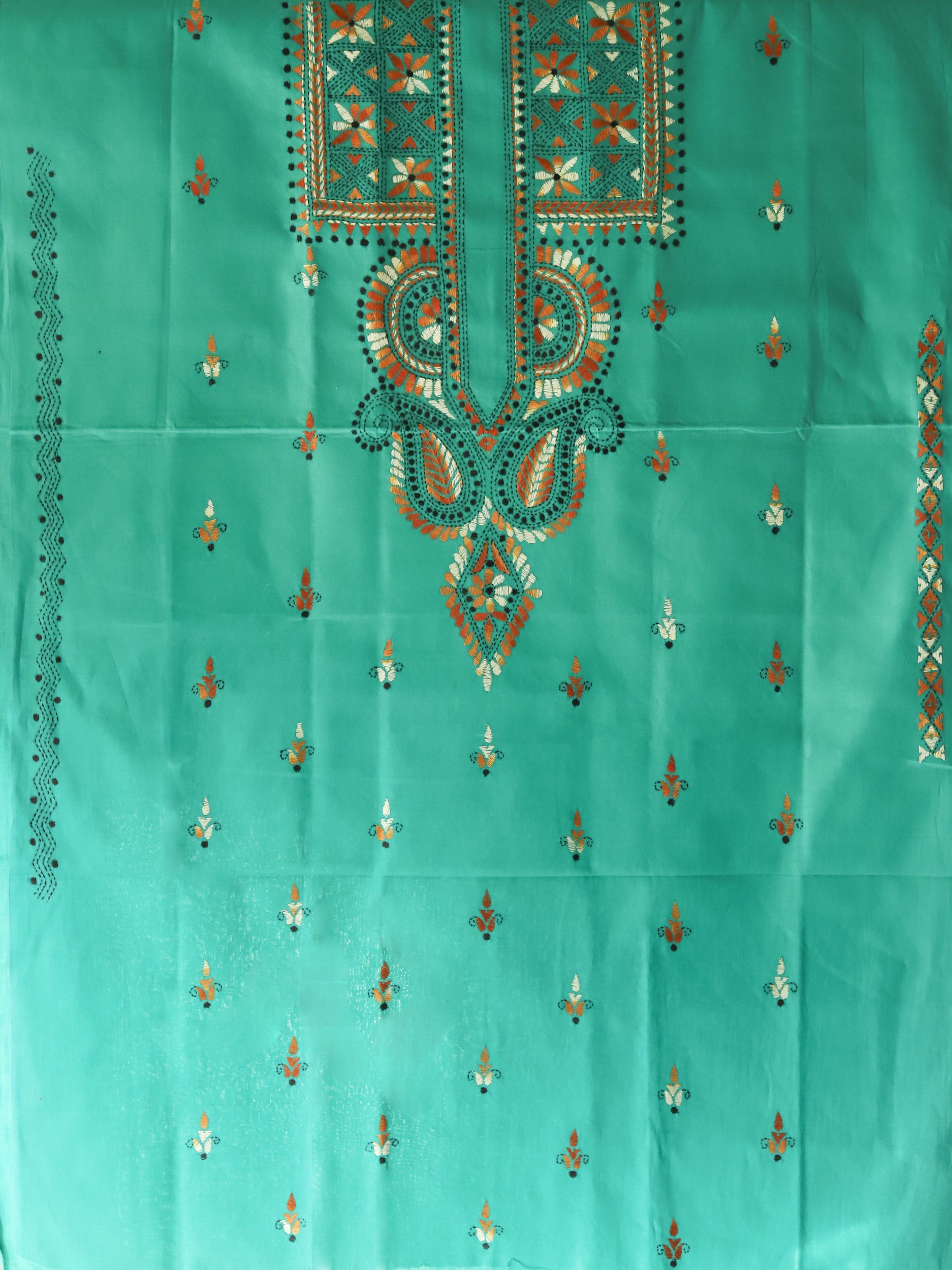 Turquoise fabric with intricate embroidery