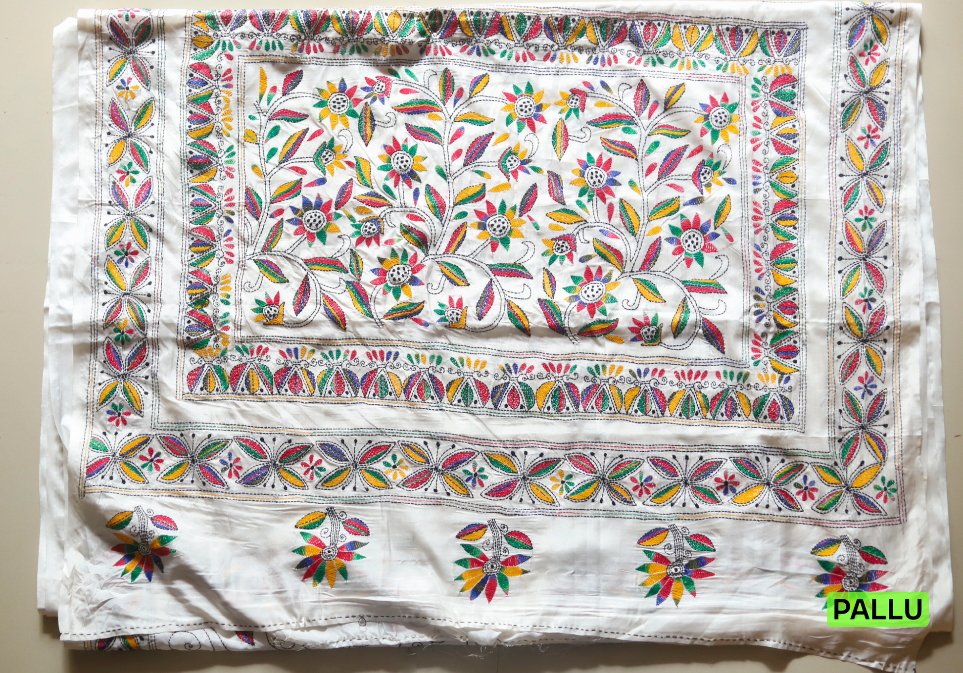 Colorful embroidered kantha saree with floral patterns on a white background, labeled 'PALLU'.